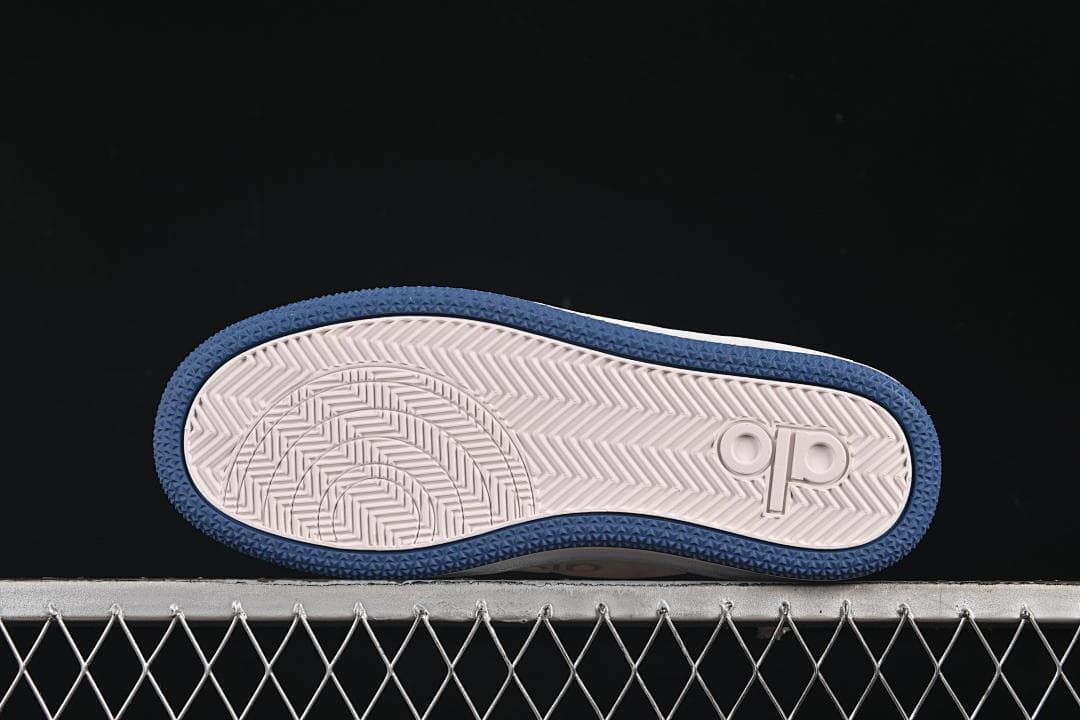 Underside view showing the patterned white and navy outsole