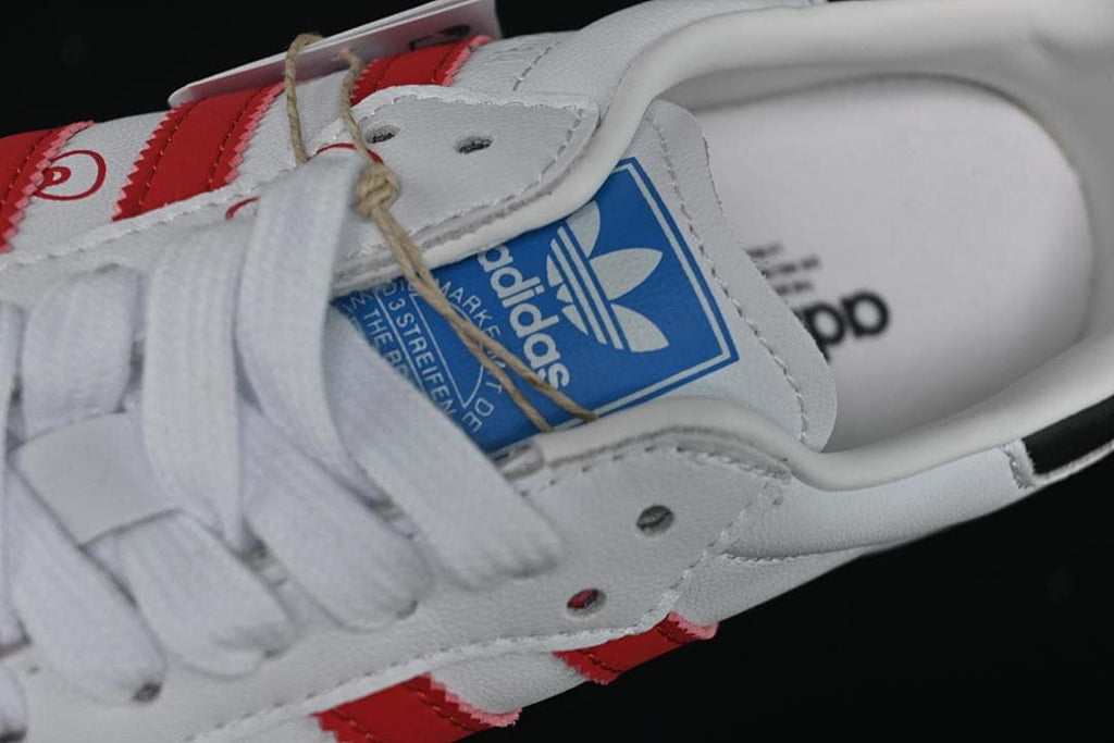 Close-up of the blue adidas tongue label and white laces