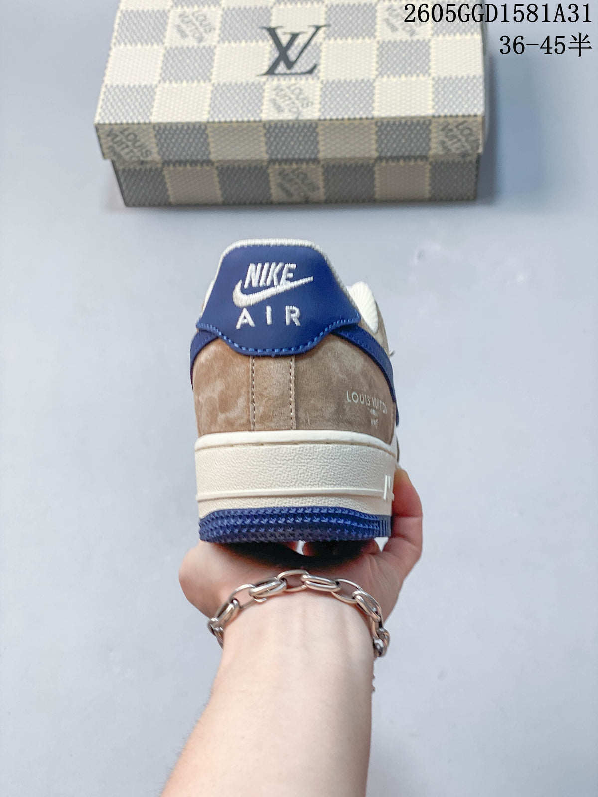 Rear view of a cream and taupe sneaker with a blue heel tab