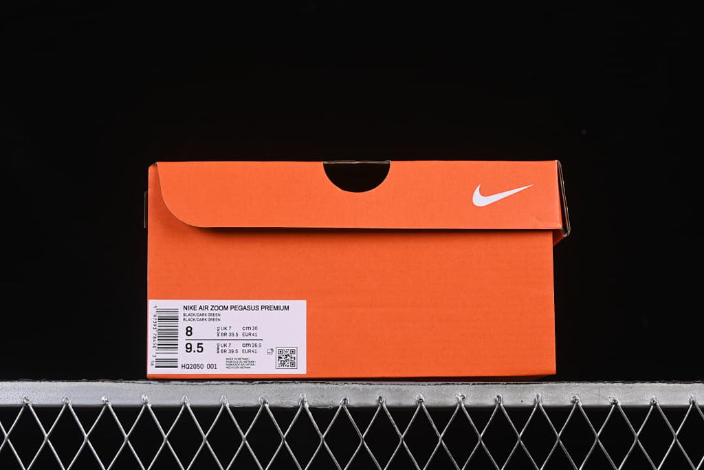 Orange Nike shoe box label showing the Pegasus Premium name, black and dark green color description, and size markings.