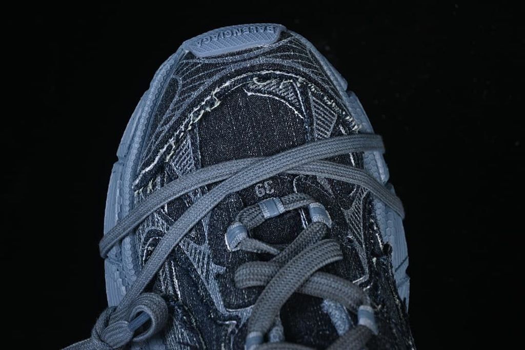 Top view of the shoe showing laces and panel stitching