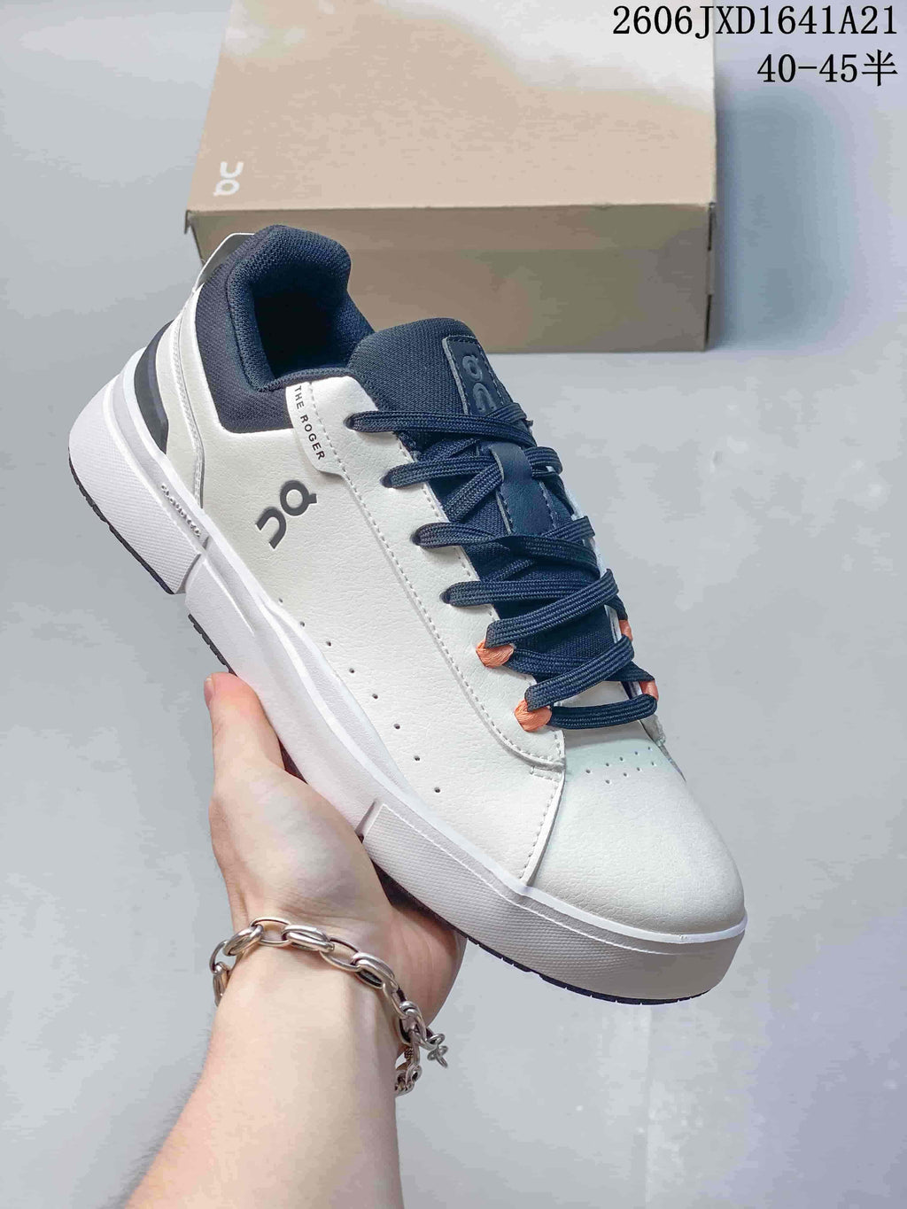 White On The Roger low-top sneaker with navy laces, collar and heel accents