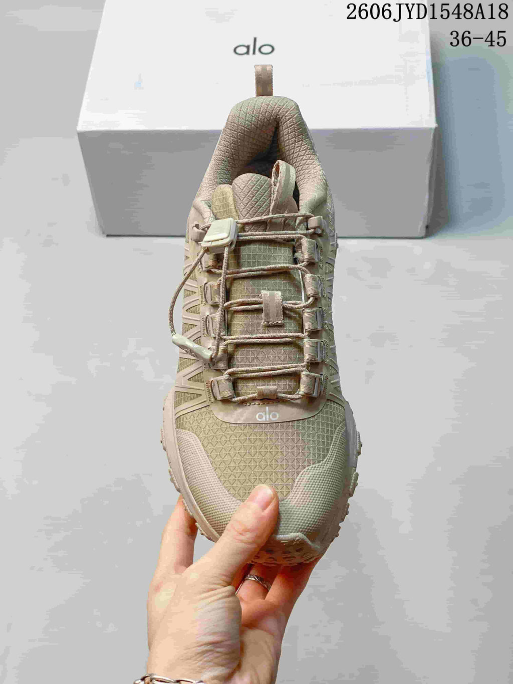 Top view of the shoe's textured upper and cord-lock lacing.