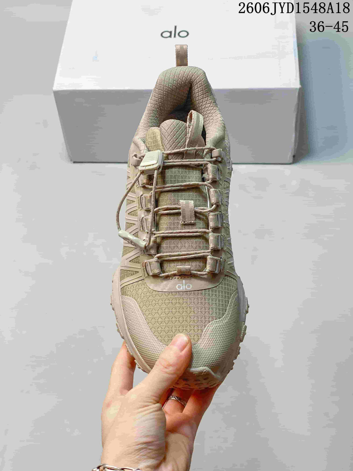 Top view of the shoe's textured upper and cord-lock lacing.