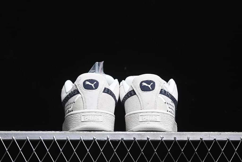 Rear view of the pair showing heel logos and textured midsoles.