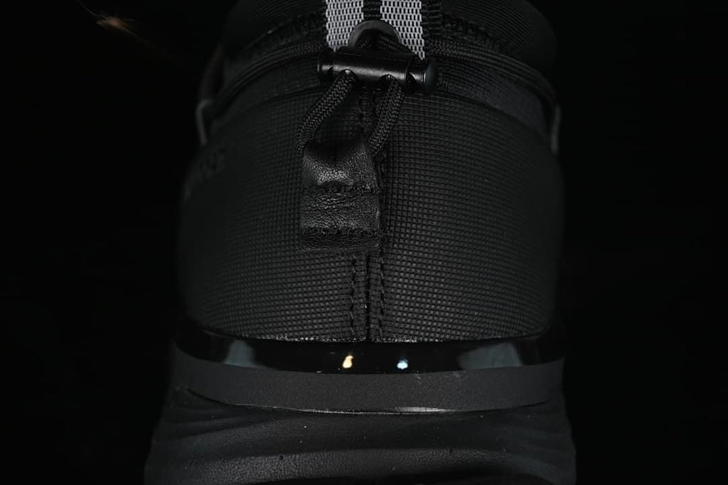 Rear view of the sneaker showing the heel pull tab and sole