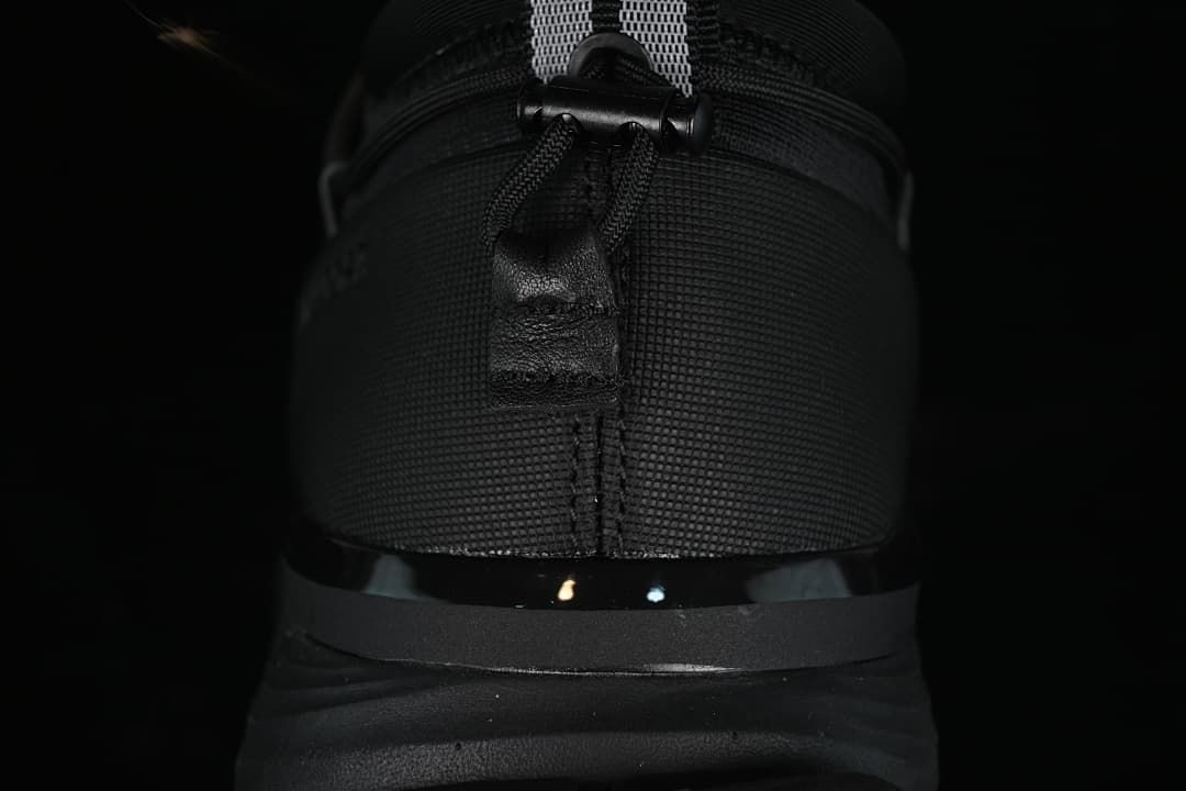 Rear view of the sneaker showing the heel pull tab and sole