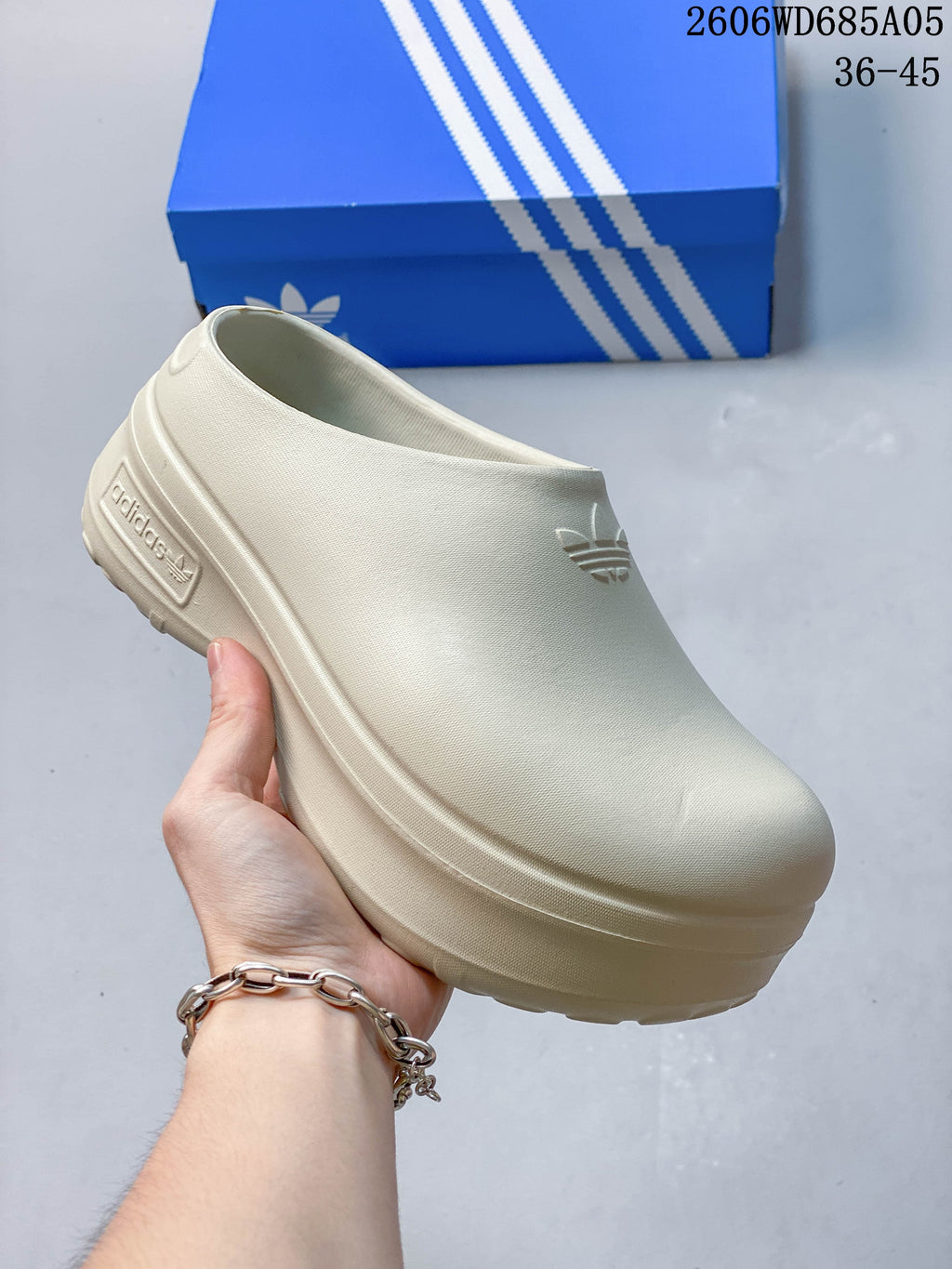 Mauve Adidas mule clog with a raised platform sole