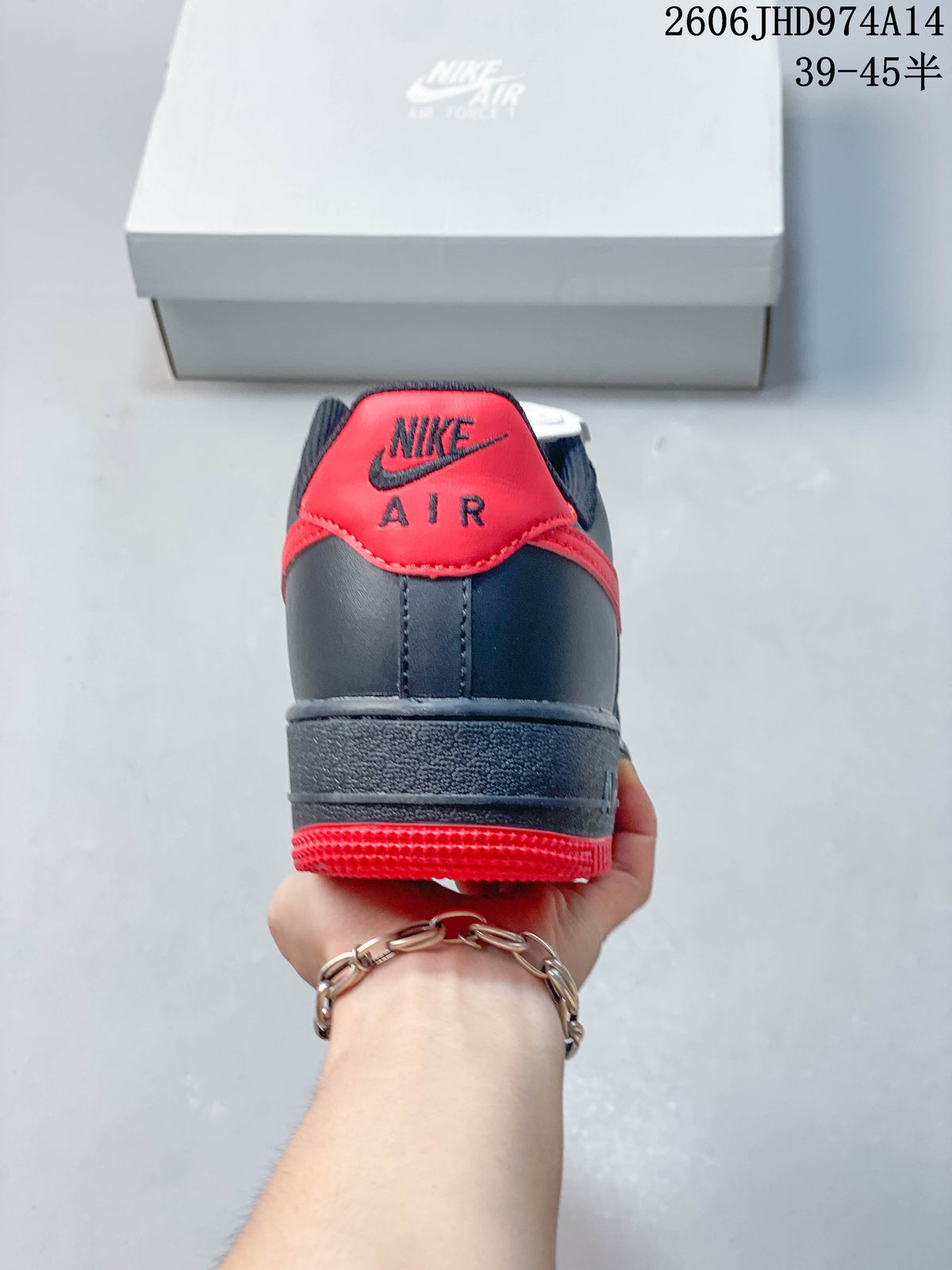 Rear view of a navy sneaker with a red heel tab and outsole