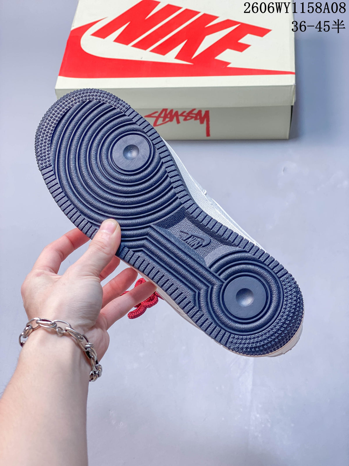 Close-up of the sneaker's dark navy outsole with concentric circular tread.