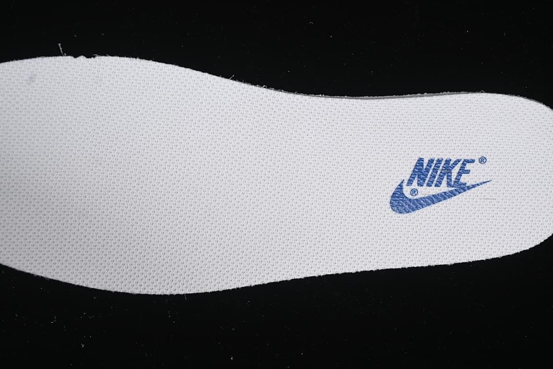 Close-up of a textured insole with a blue Nike logo