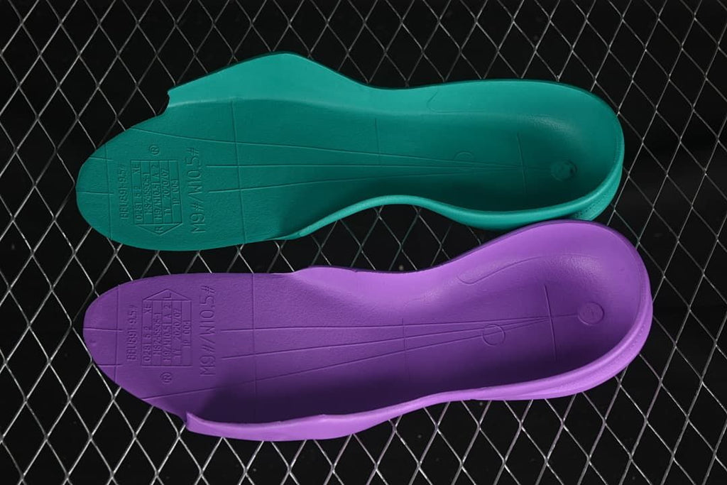Two removable shoe inserts shown from the underside