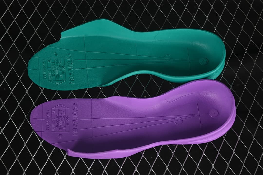 Two removable shoe inserts shown from the underside