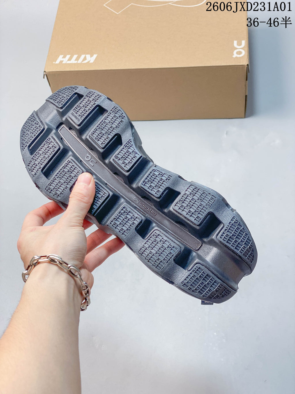 Underside of the sneaker showing the sculpted outsole and tread
