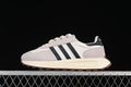 Side view of the adidas Retropy E5 sneaker in cream, light gray, and black.