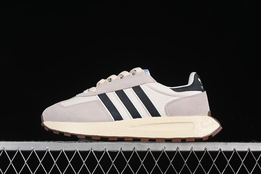 Side view of the adidas Retropy E5 sneaker in cream, light gray, and black.