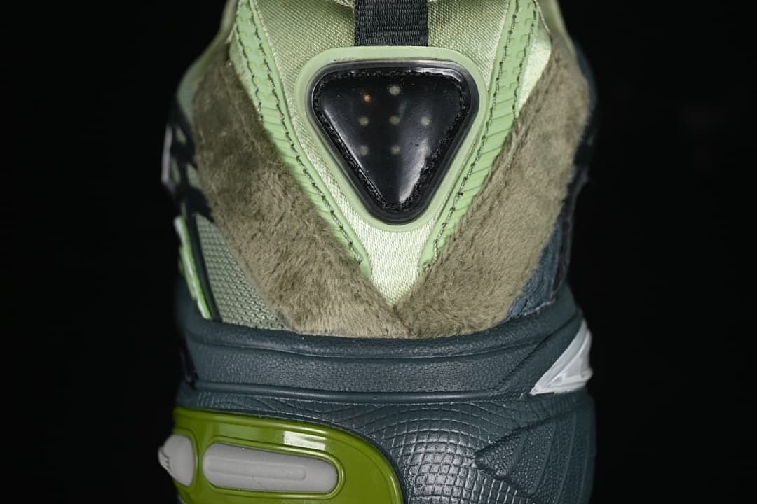 Rear view showing layered heel panels and the sculpted sole.