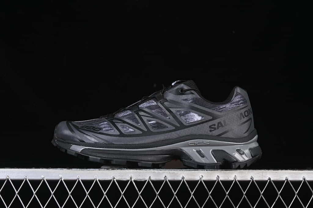 Side view of dark gray Salomon XT-6 Camo sneakers