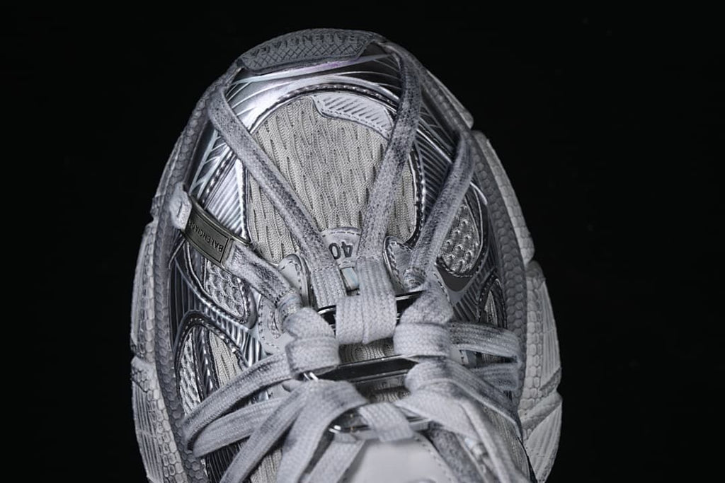 Top-down view of the sneaker showing its layered lace arrangement