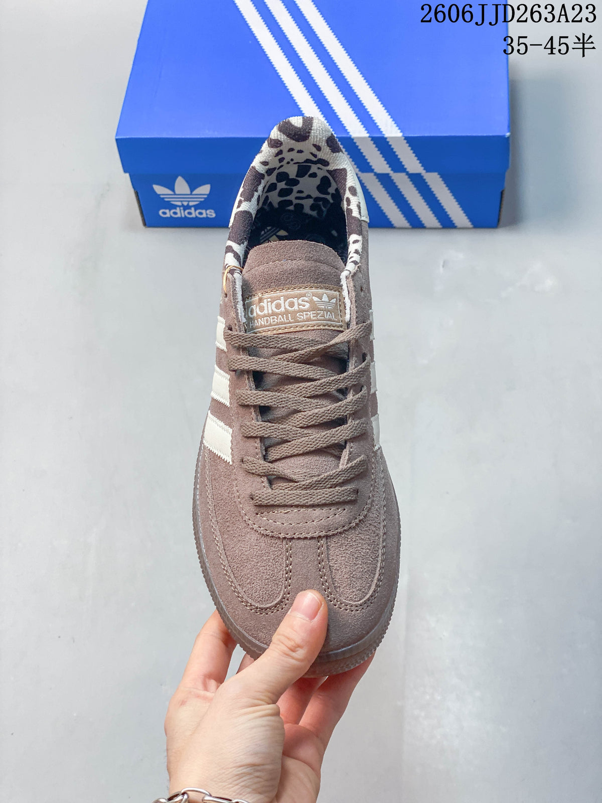 Front view of the sneaker showing its laces, toe stitching and patterned lining.