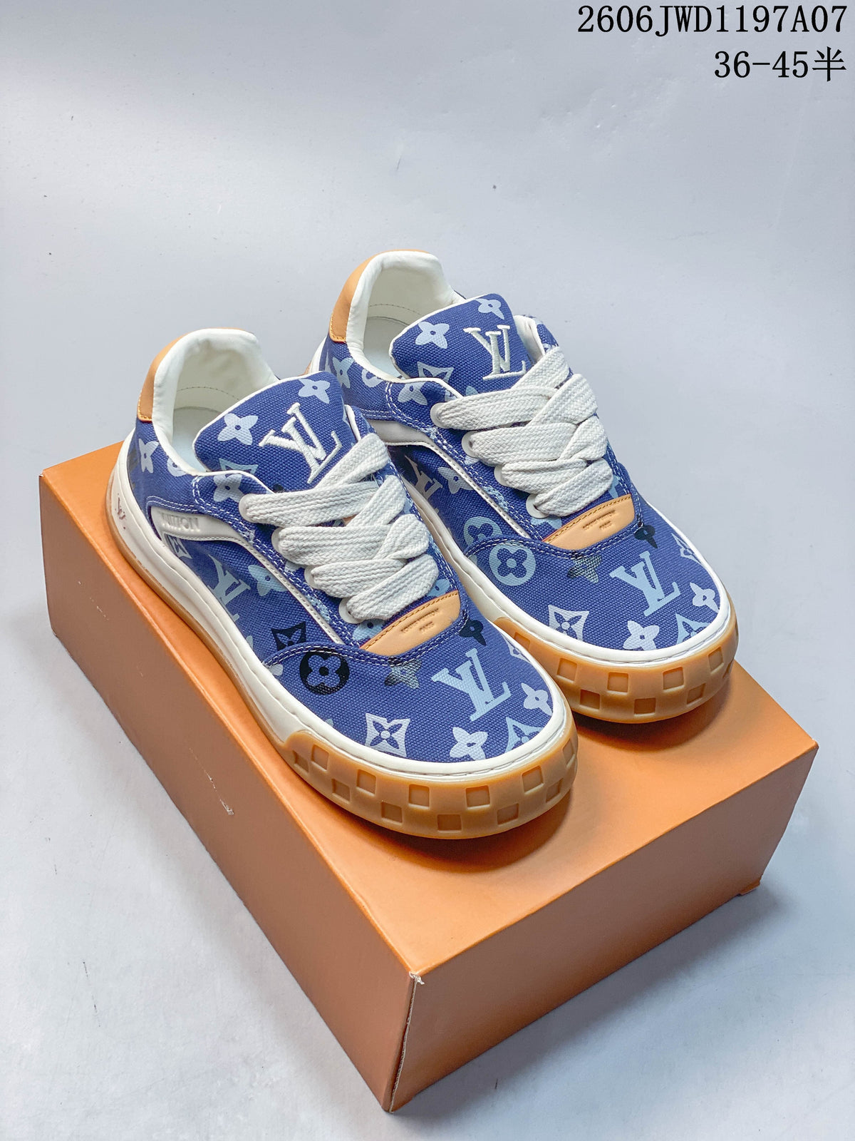 Pair of blue monogram-patterned Louis Vuitton Tilted lace-up sneakers with white laces and gum-colored soles