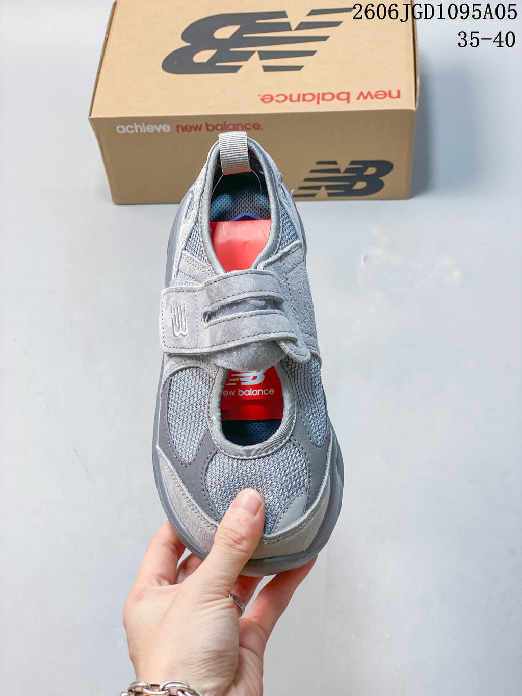 Top view of the gray sneaker showing mesh panels and hook-and-loop strap