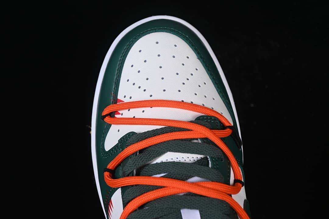 Top view of perforated white toe and orange laces