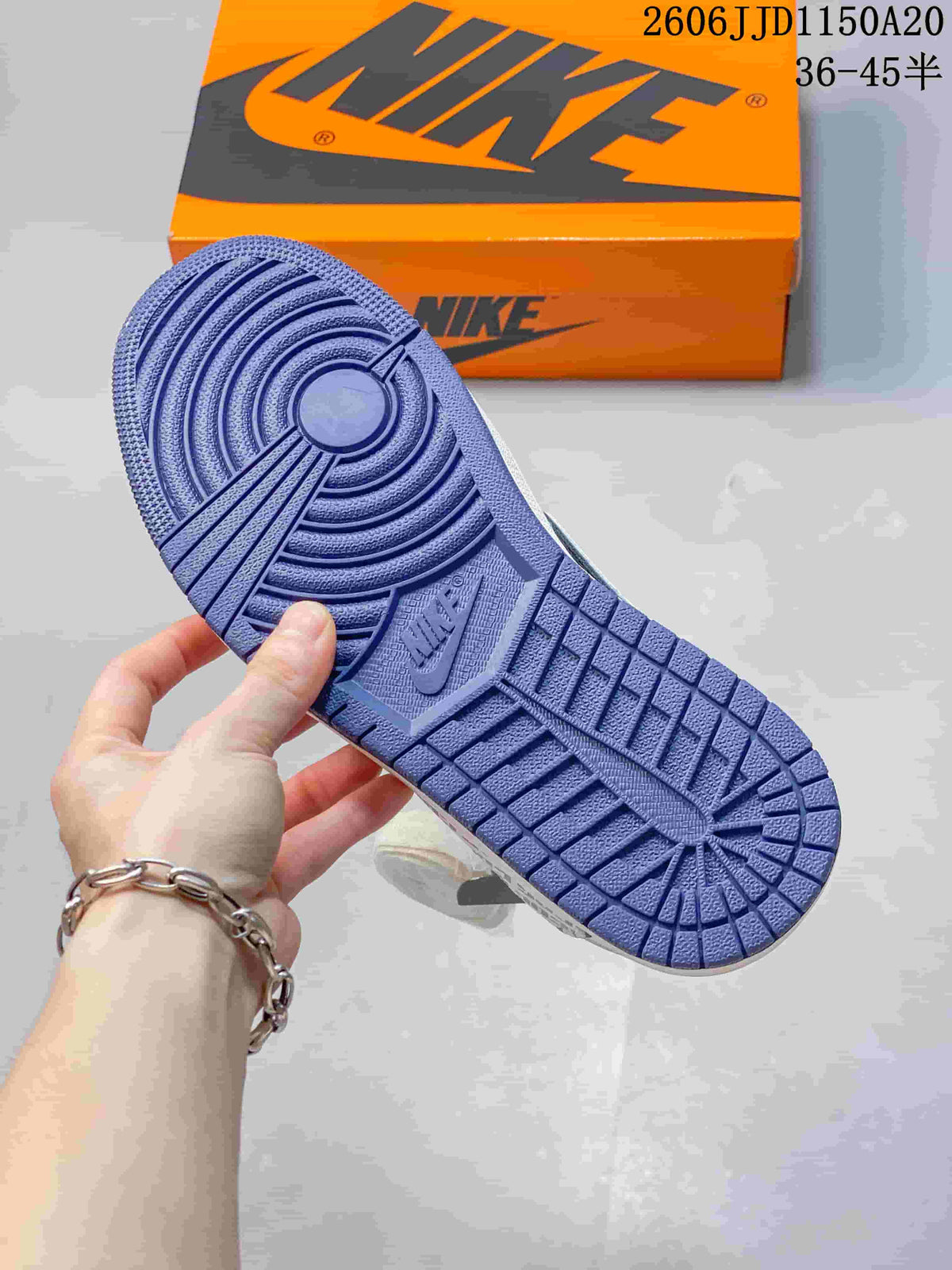Close-up of the blue-toned outsole on the low-top sneaker.
