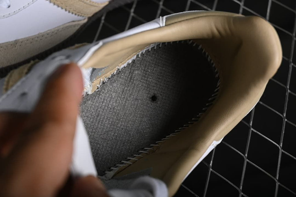 Interior view of the sneaker showing the lining and footbed