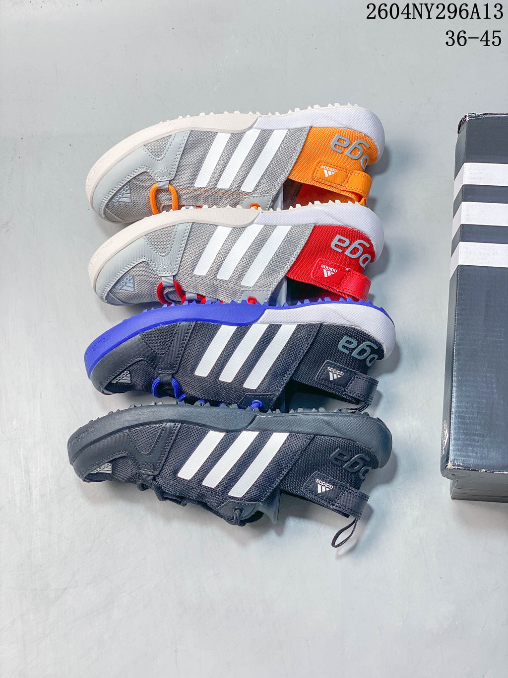 Four adidas TERREX color combinations shown from above, including dark gray, blue, red and orange accents.