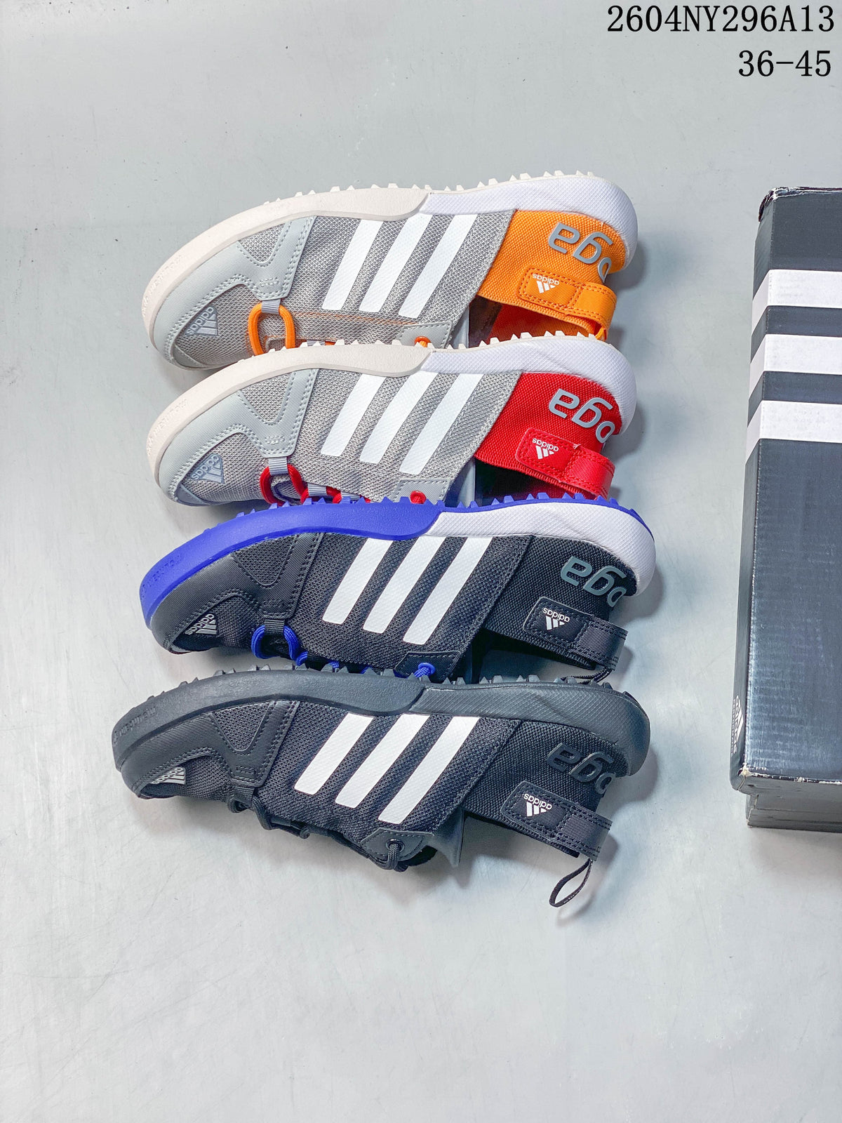 Four adidas TERREX color combinations shown from above, including dark gray, blue, red and orange accents.