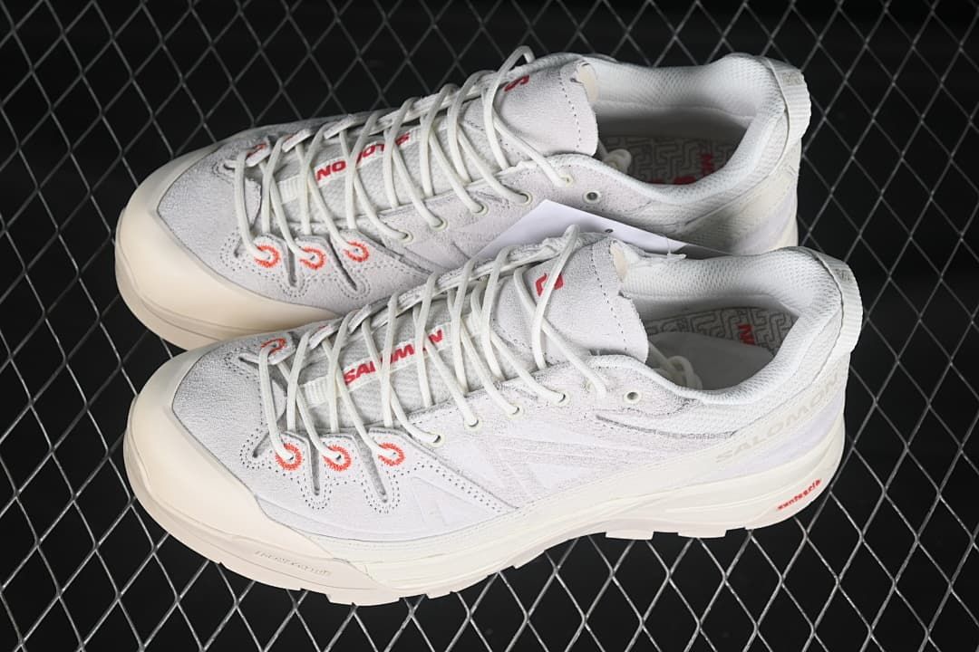 Pair of light-colored X-ALP shoes viewed from above at an angle