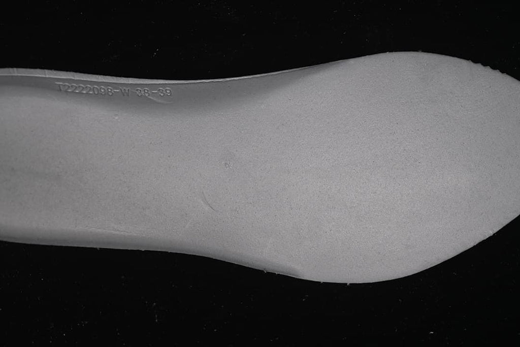 Close-up of embossed markings on the shoe outsole