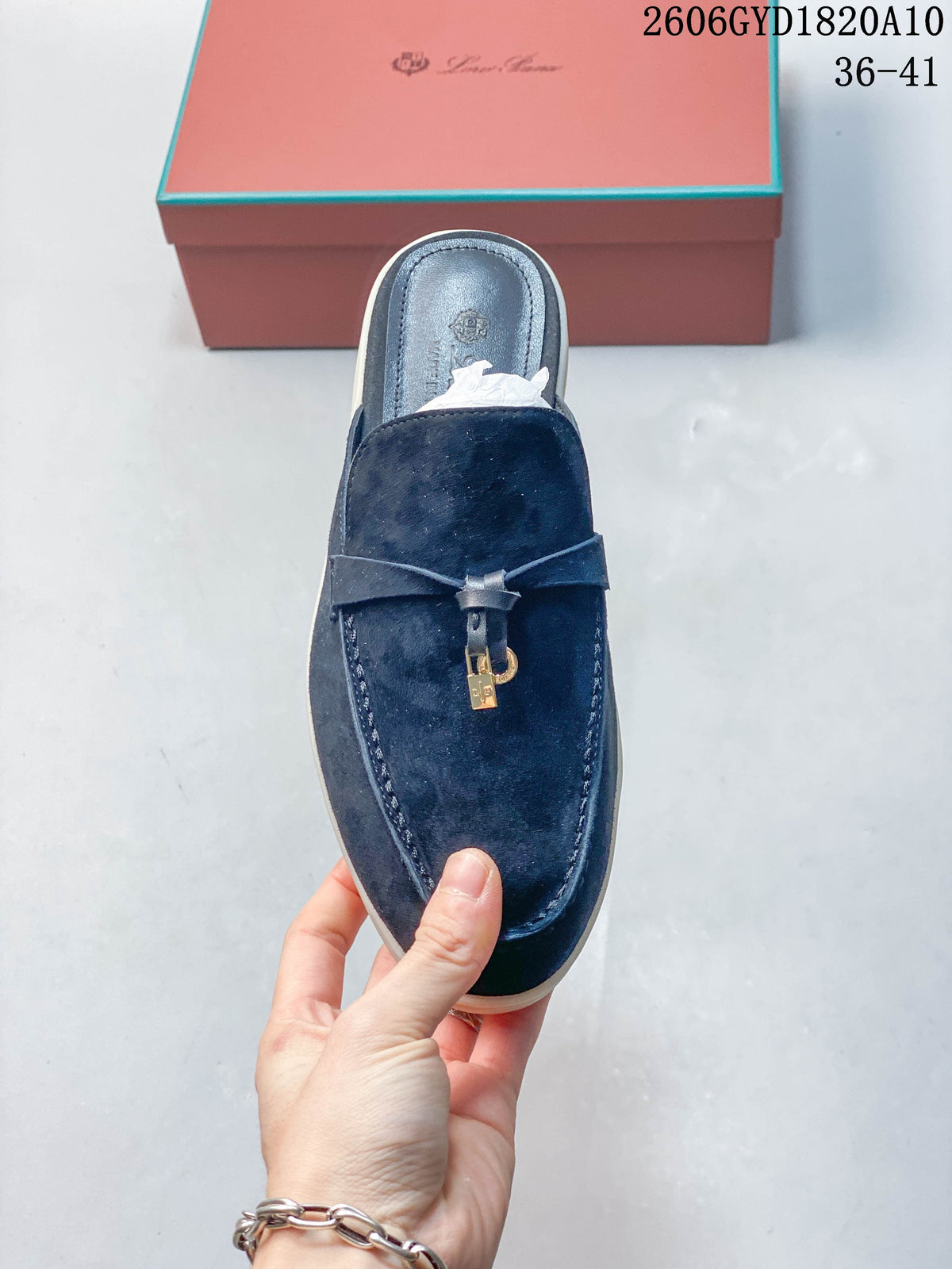 Top view of a navy mule loafer with a strap and lock-style metal accent; photo overlay shows style code 2606GYD1820A10 and sizes 36–41.