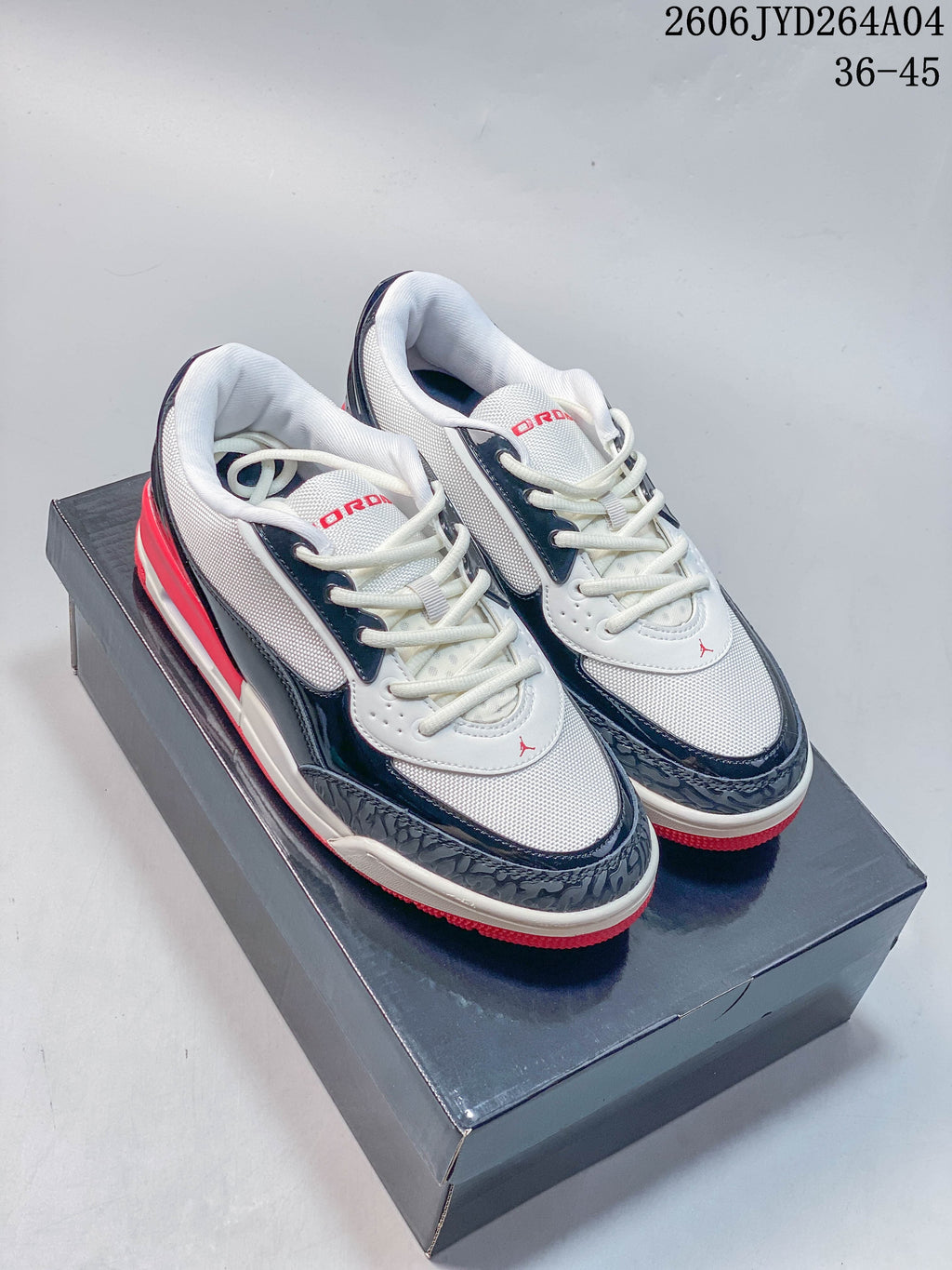 Pair of white, navy, and red Jordan Air Jordan Ultra sneakers shown from above