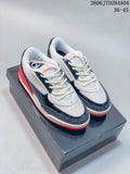 Pair of white, navy, and red Jordan Air Jordan Ultra sneakers shown from above
