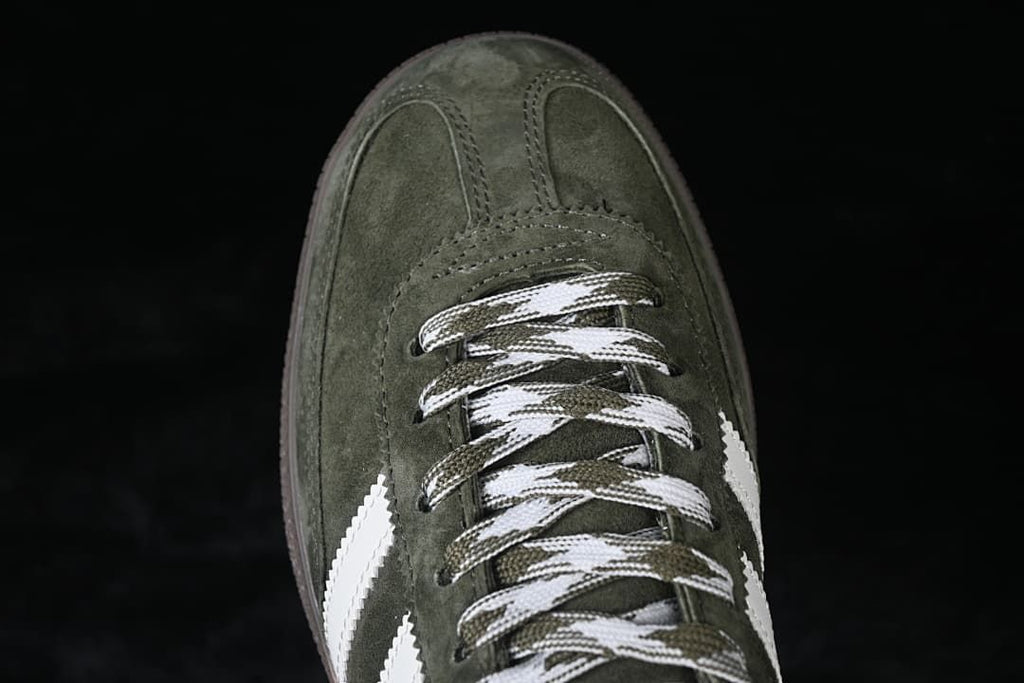 Top-down close-up of the green toe and patterned laces