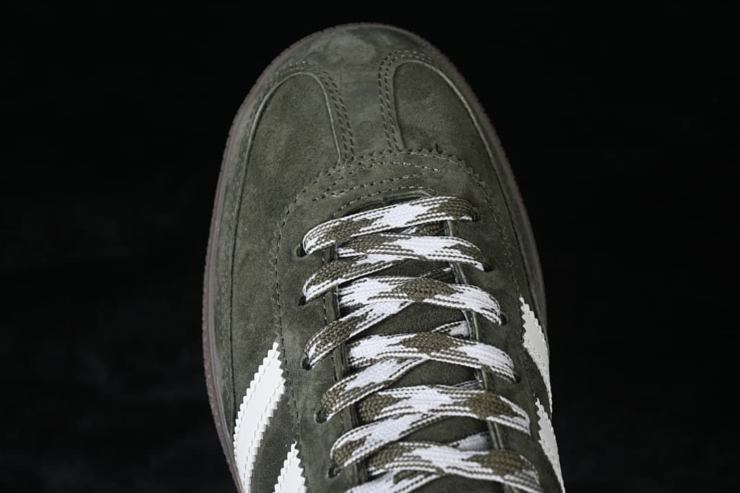 Top-down close-up of the green toe and patterned laces