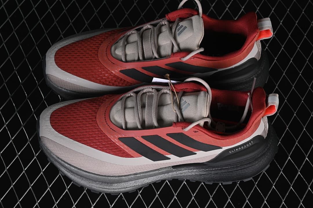 Pair of red and gray Ultraboost 5 shoes viewed from above