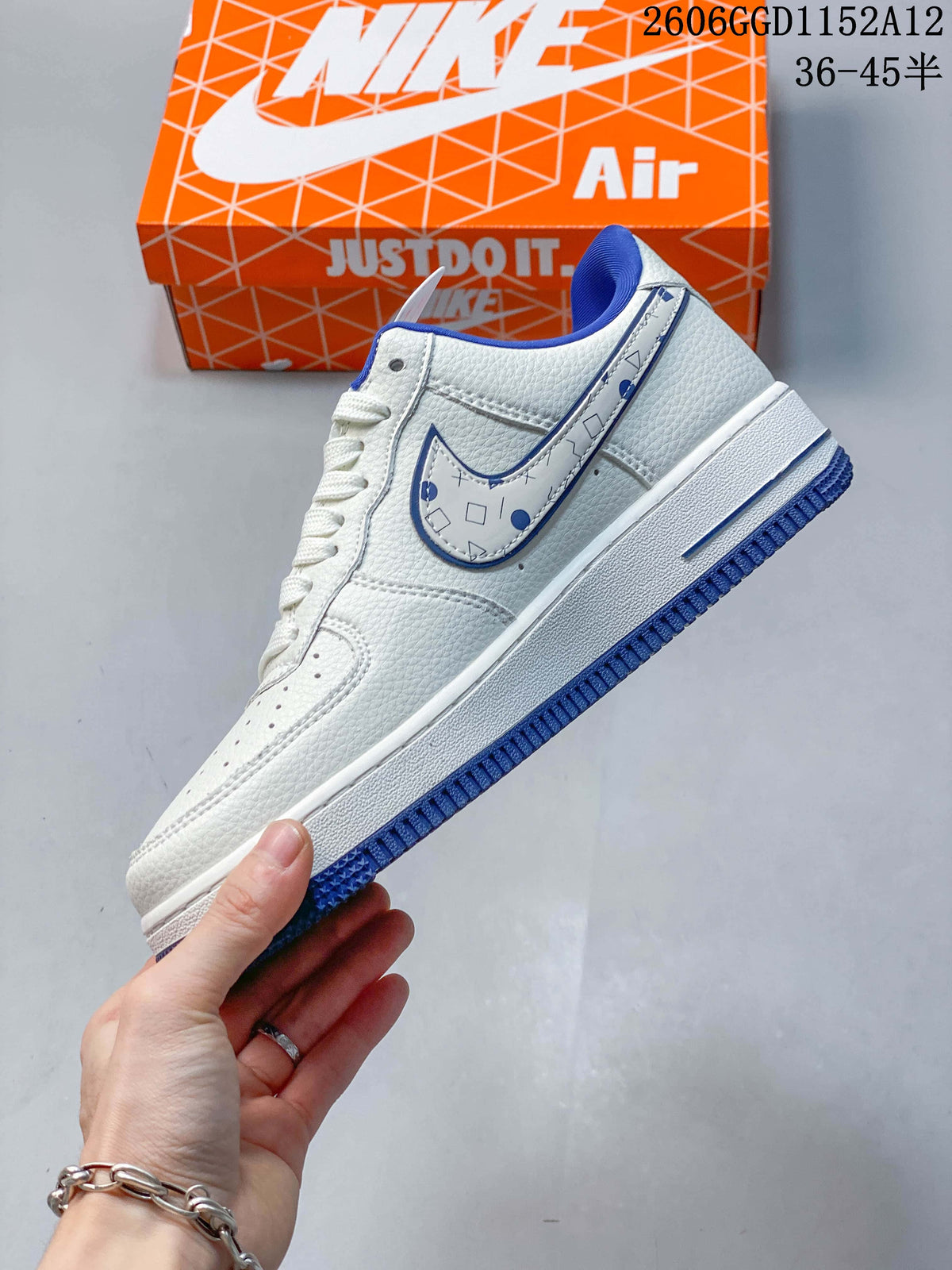 Side view highlighting the patterned Swoosh and blue accents