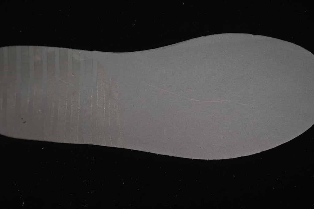 Close-up of the light-colored shoe outsole