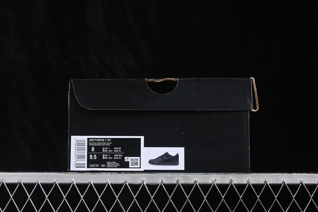 Black Nike shoe box with a label identifying Air Force 1 '07, color information, style code IQ9791-001, and a photographed size of EU 41.