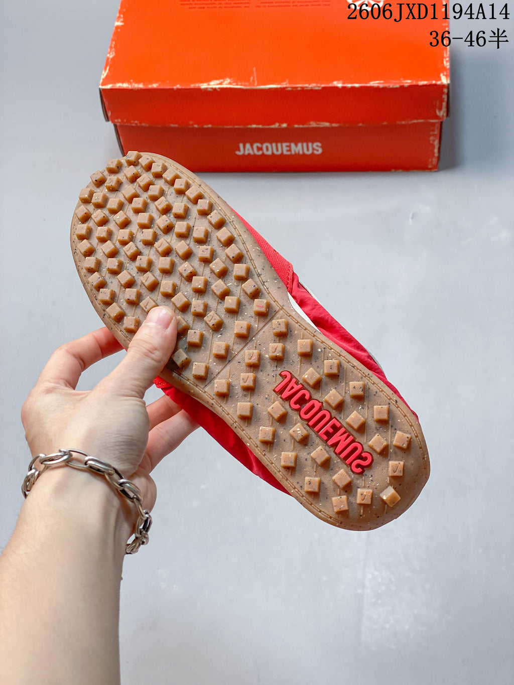 Close-up of the gum-colored outsole with raised tread and Jacquemus branding