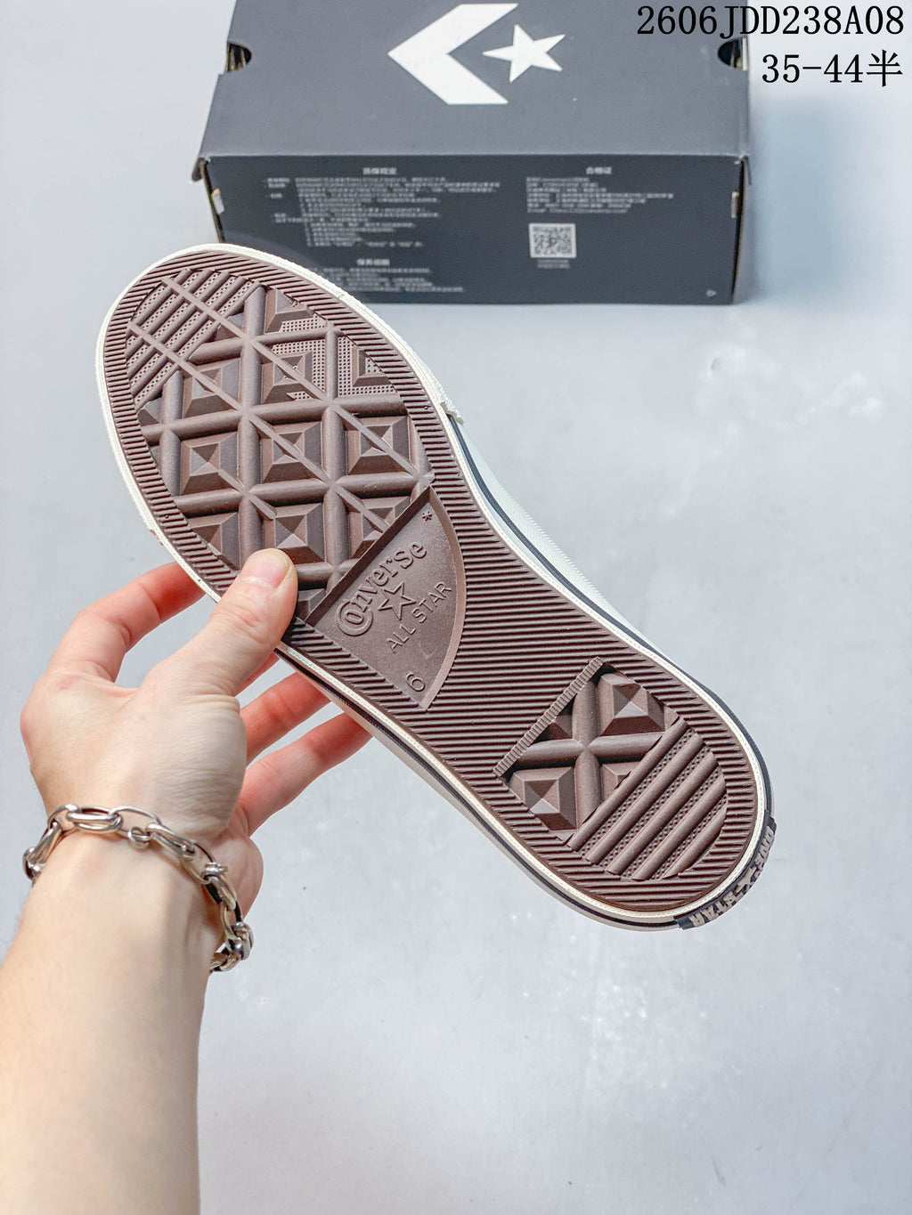 Close-up of the patterned outsole on a white Converse One Star sneaker