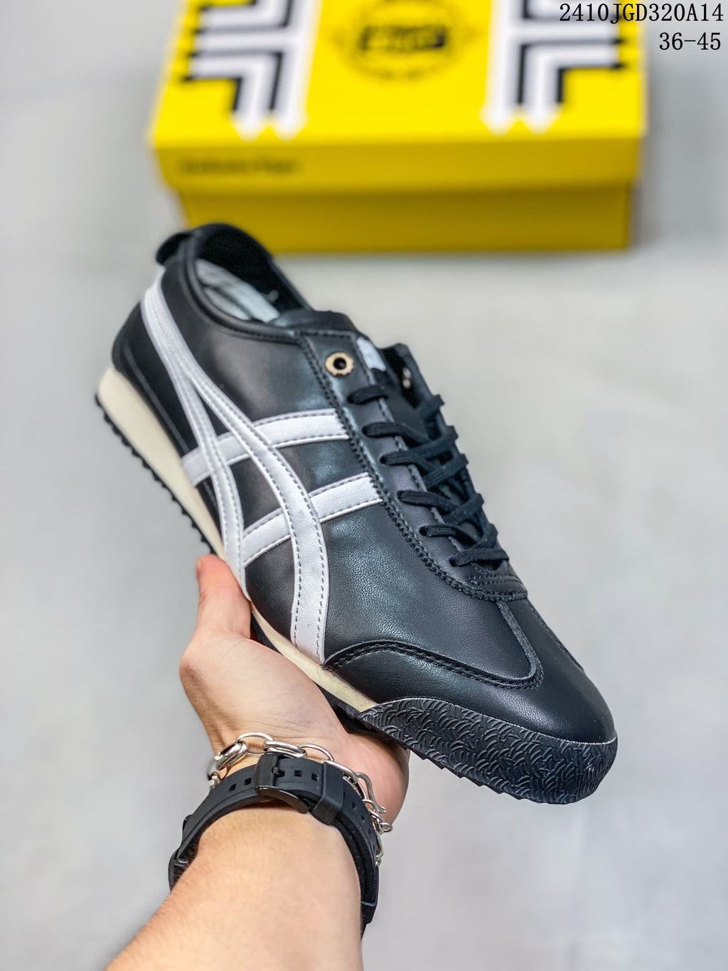 Black low-top sneaker with white side stripes
