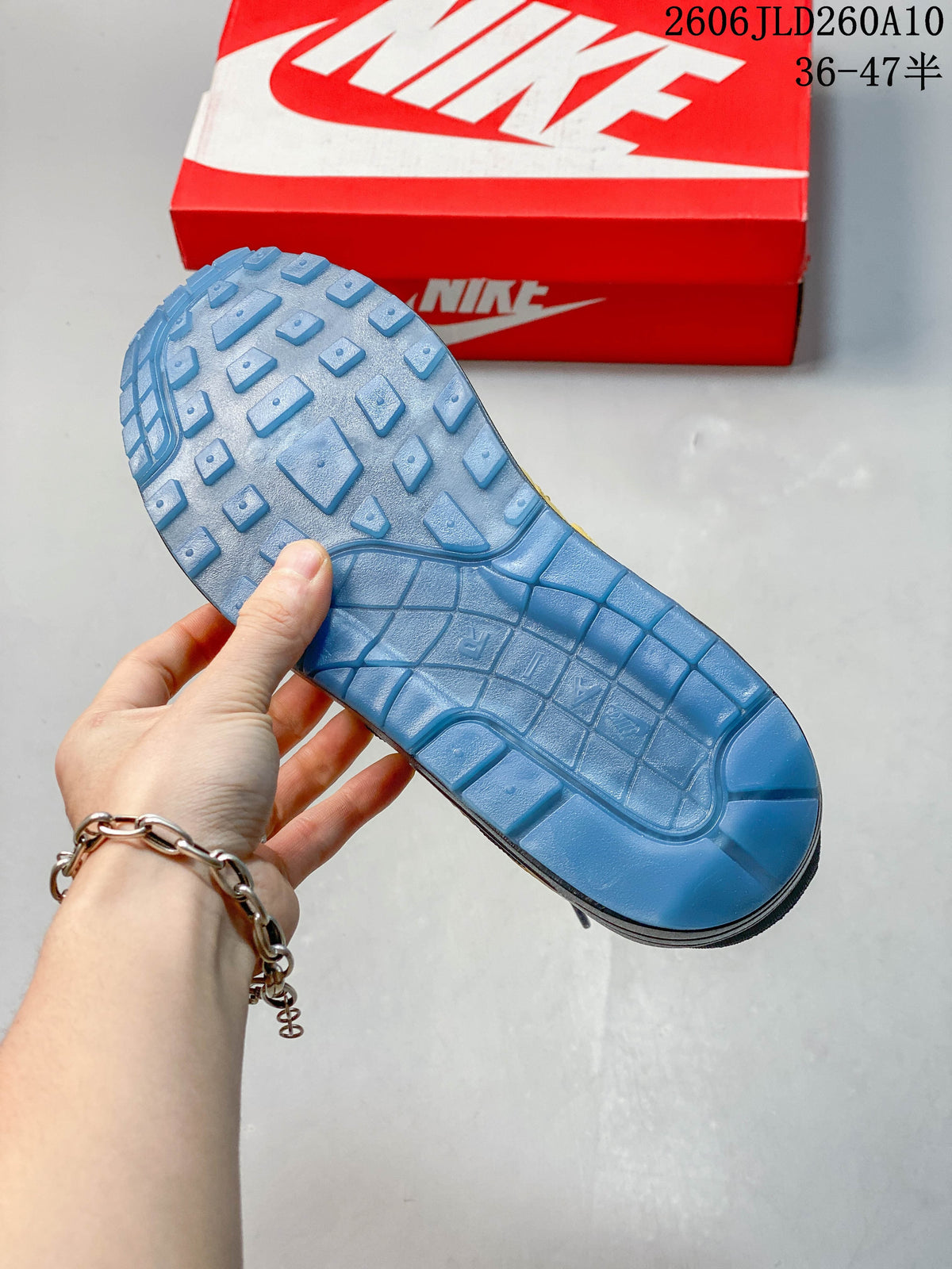 Blue-toned outsole showing the tread pattern