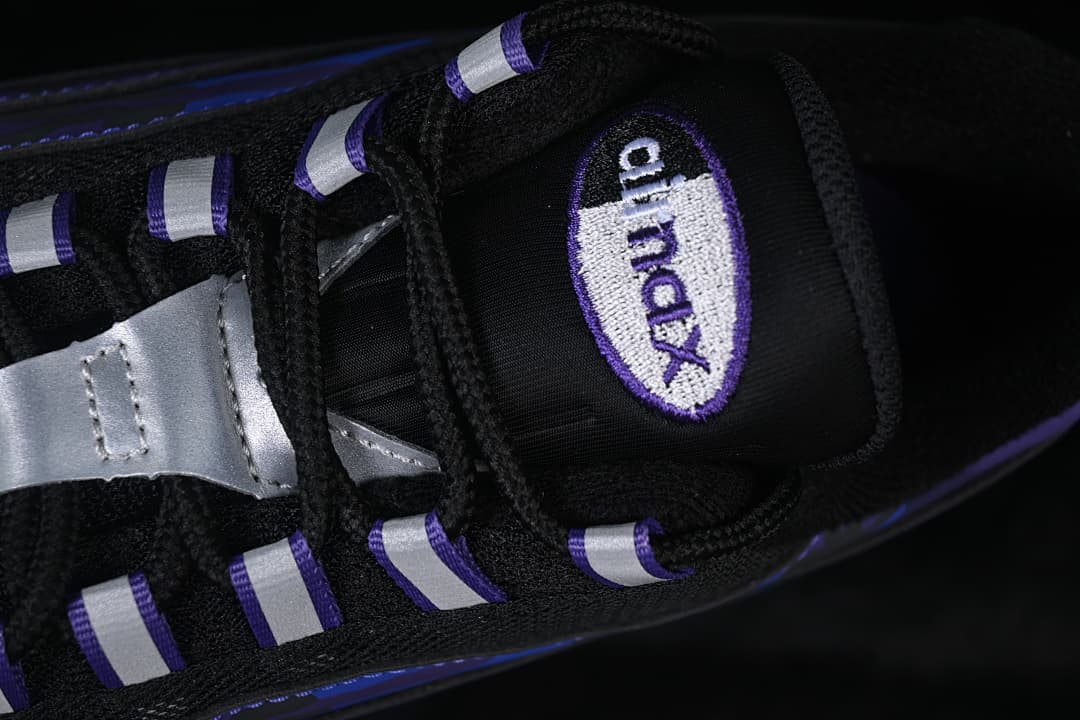 Close-up of the tongue badge, black laces, and silver lace details