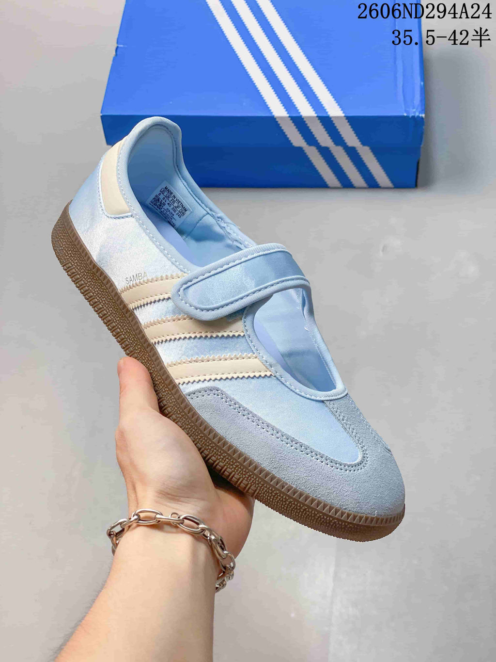 Light blue adidas Samba Jane sneaker with pale stripes and strap closure