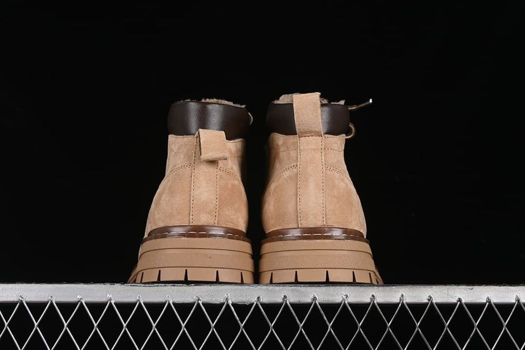 Rear view of the pair showing pull loops and lugged soles