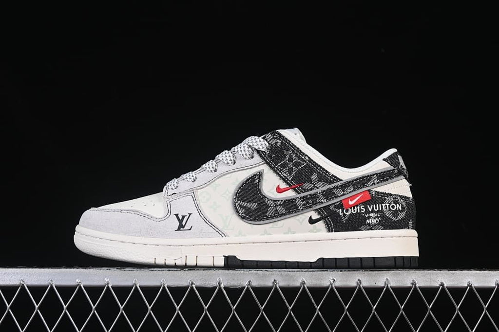 Side view of a white and black low-top sneaker with layered Swoosh details and red accents